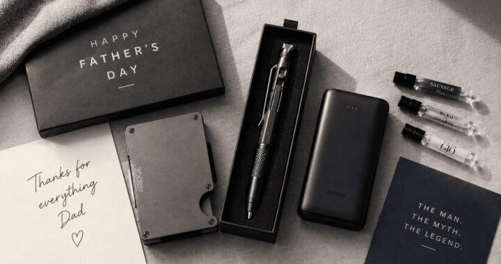 Neatly arranged Father's Day gift flatlay on a light grey linen surface, featuring a slim metal wallet, a multitool pen in a gift box, a compact power bank, and small cologne sample vials, warm natural window light, styled like a lifestyle magazine, top-down angle.